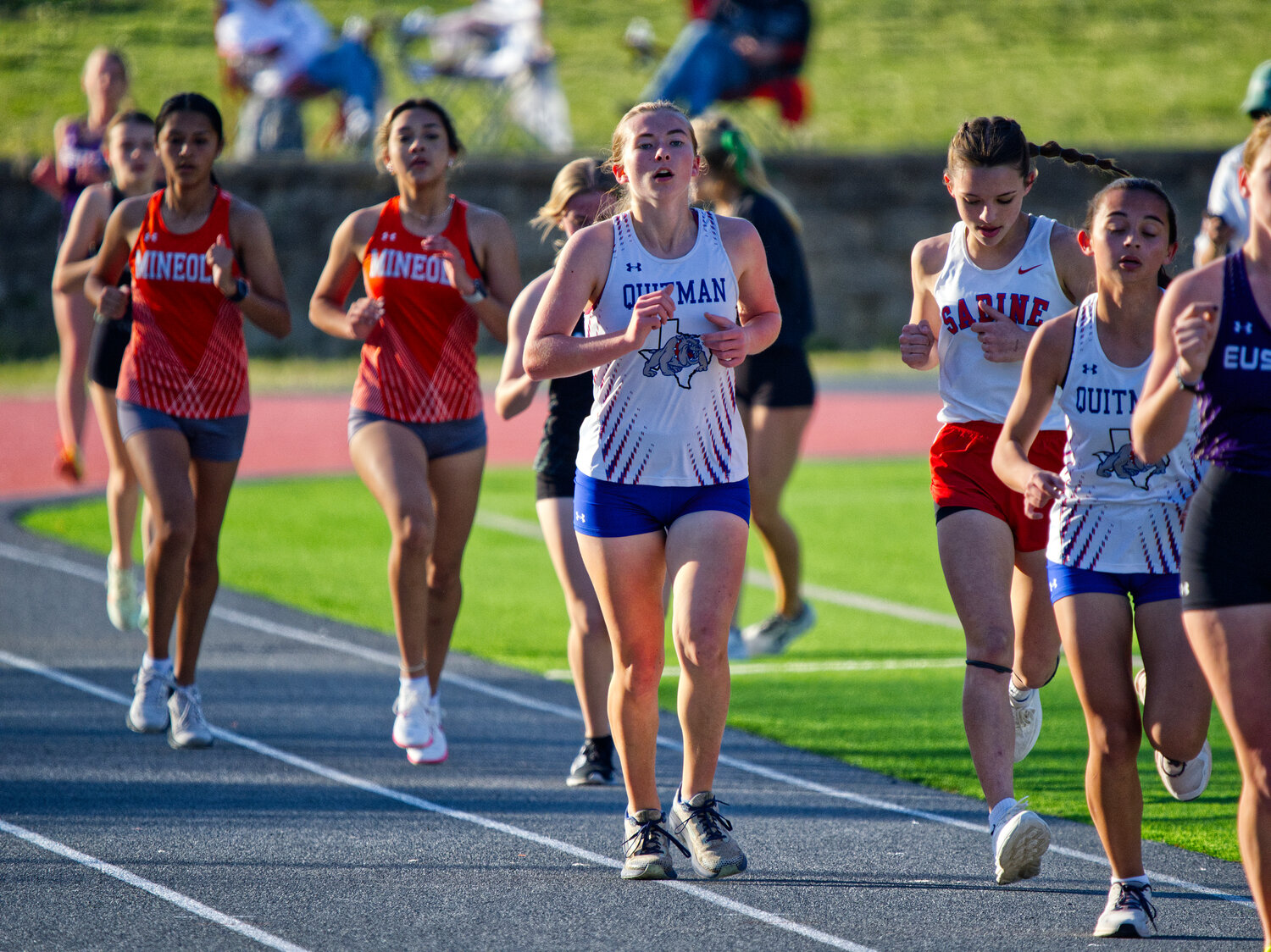 Quitman runners McKenna Wood (middle) and Katelyn De Gorostiza outpace  Yareli Hernandez (left) and Carolina Arreguin of Mineola in the 1600 meters. [take in more track images]